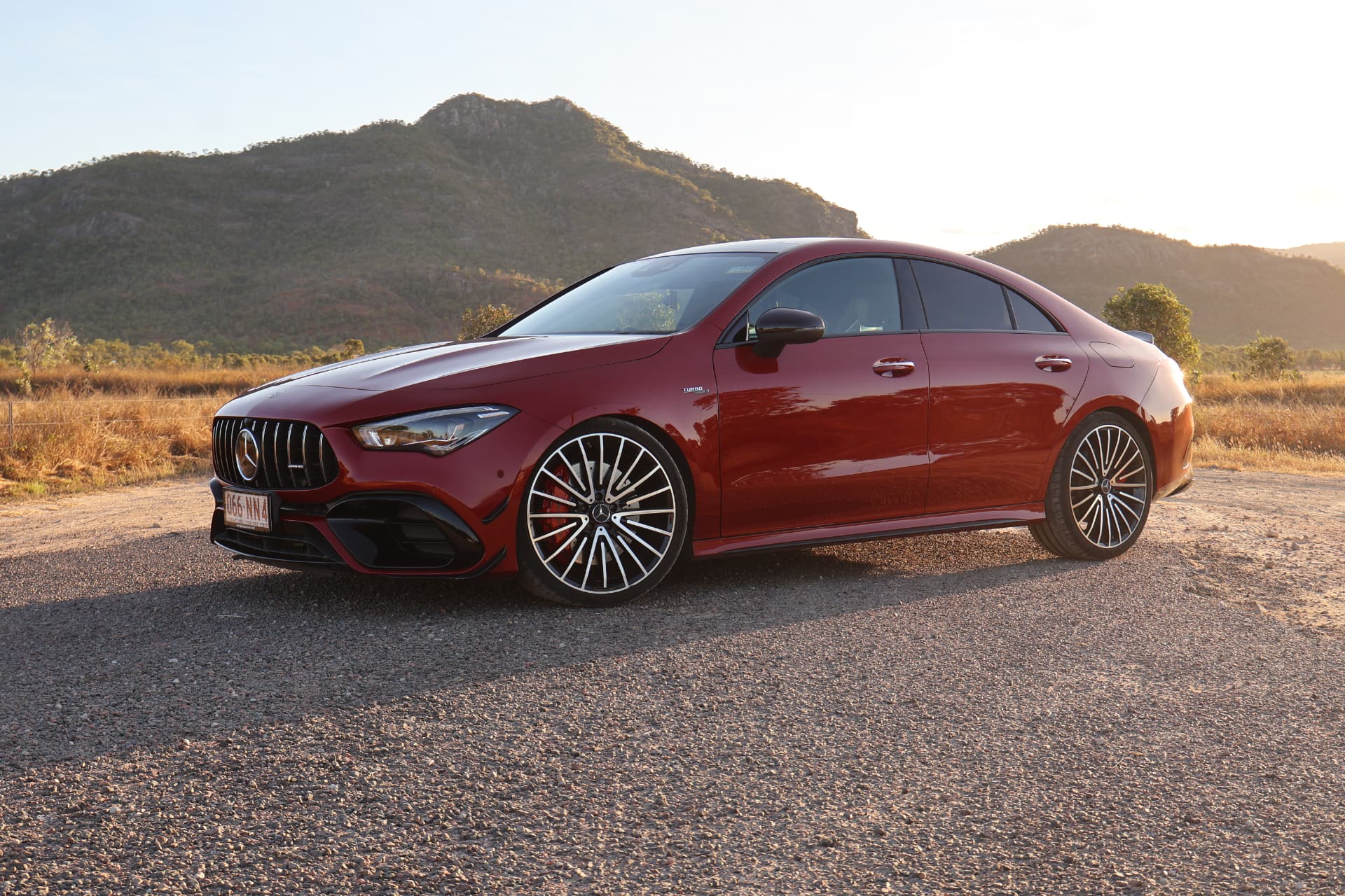 Red Mercedes-AMG CLA 45s at golden hour