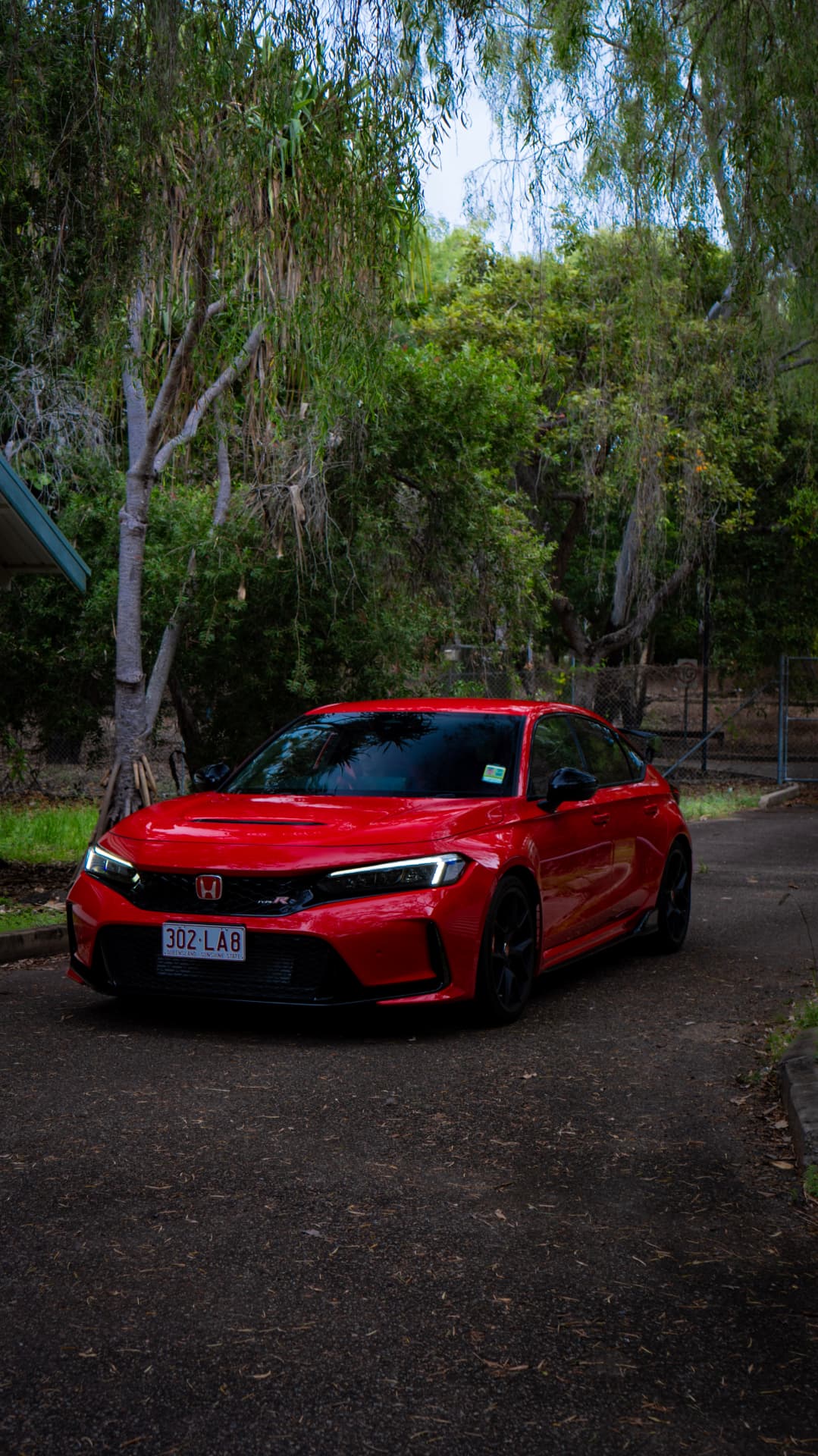Red Civic Type R front three-quarter under gum trees