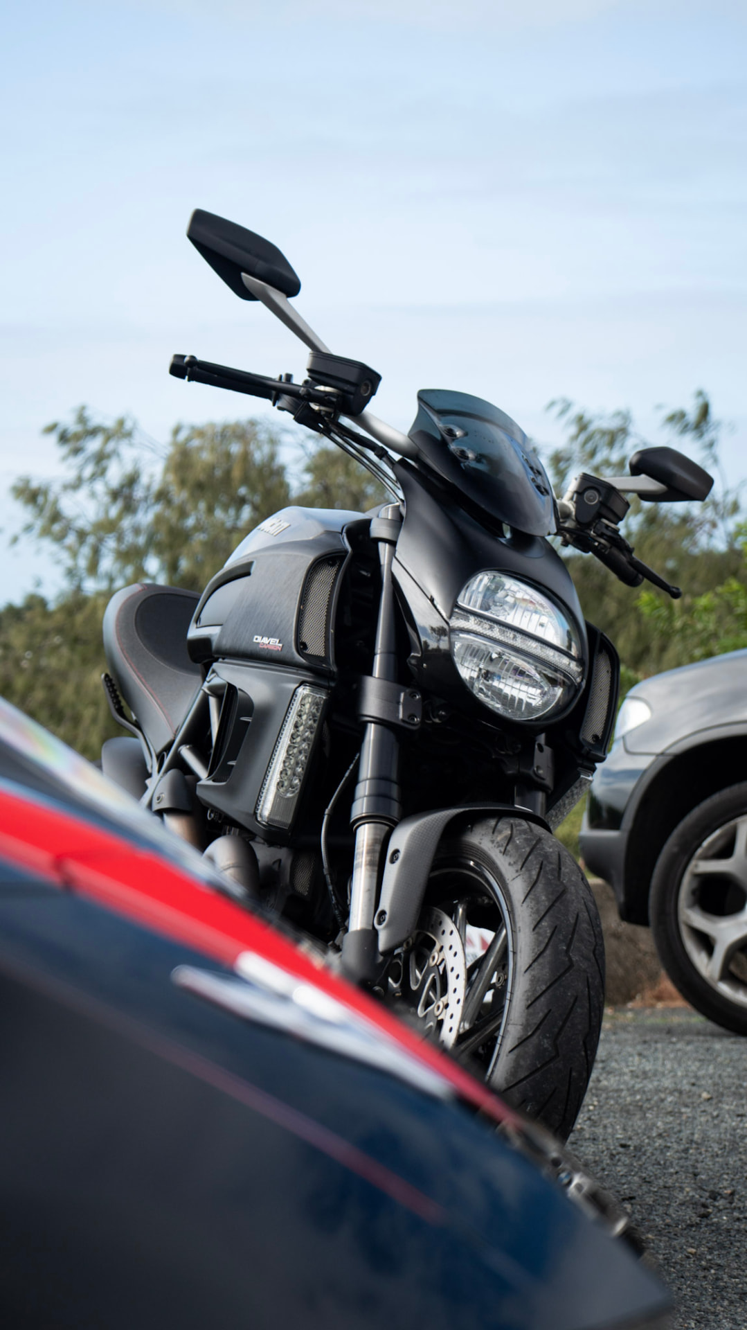 Ducati Diavel Carbon front three-quarter by the coast