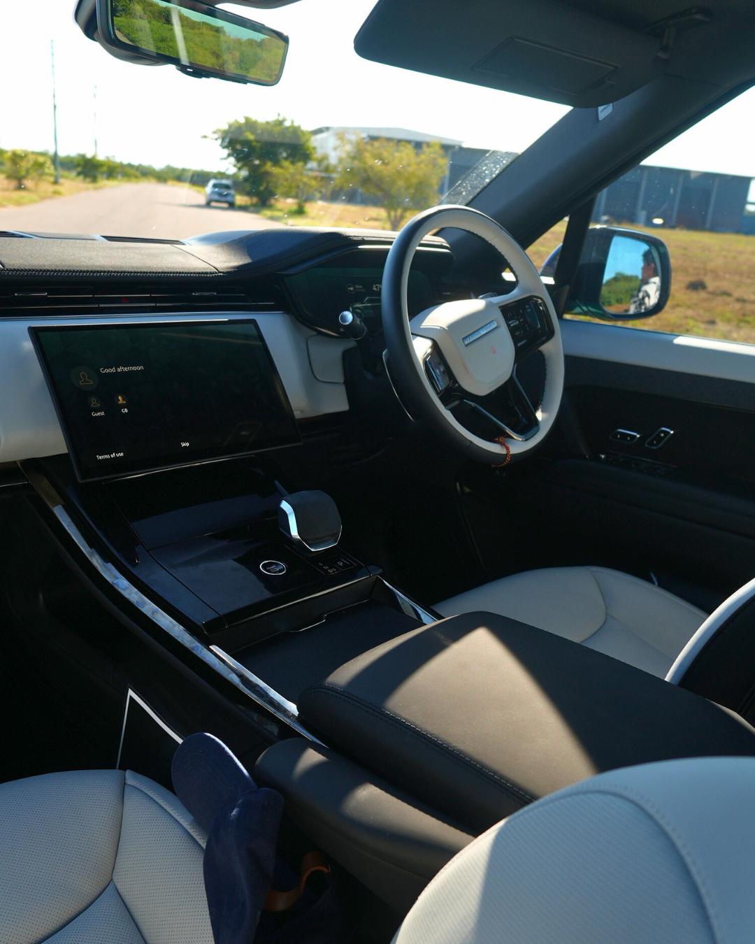 Range Rover Sport interior with white leather and curved display