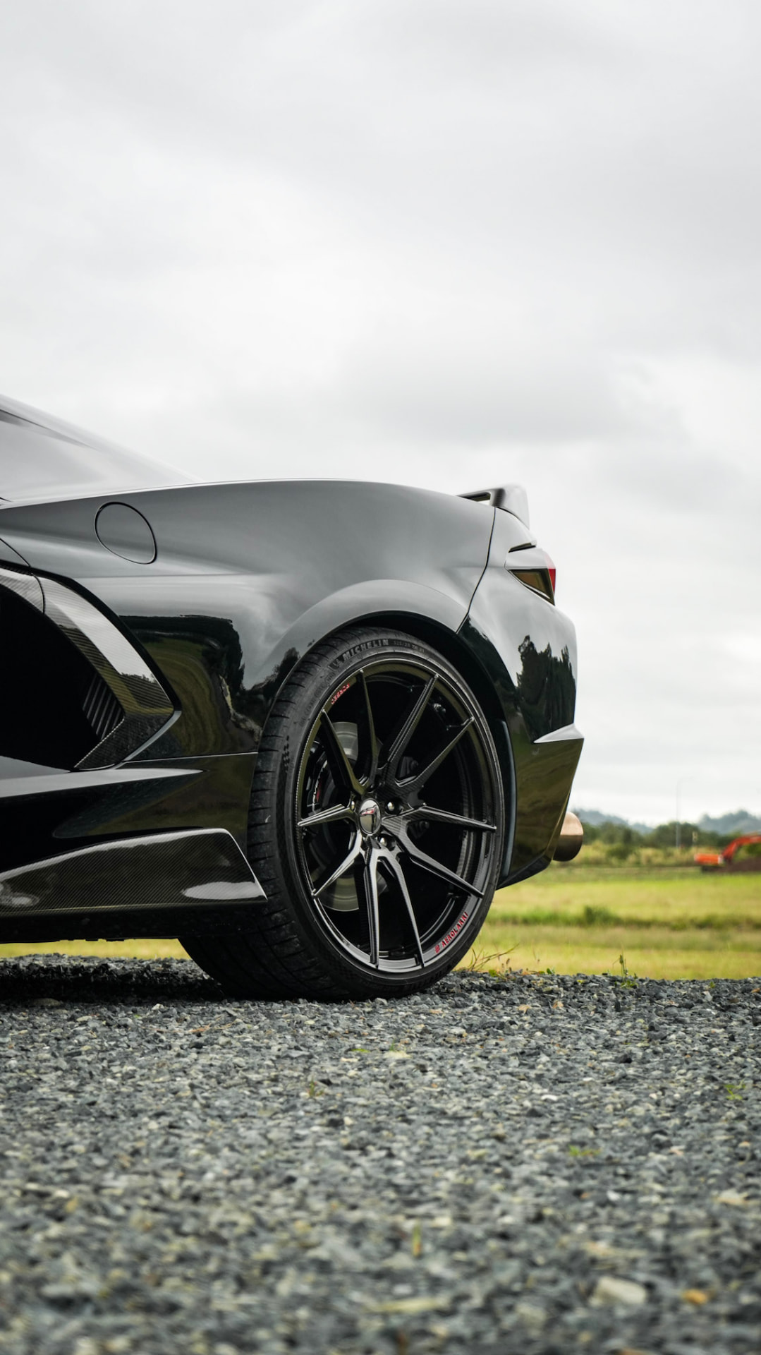 Corvette C8 rear quarter and forged wheel on gravel