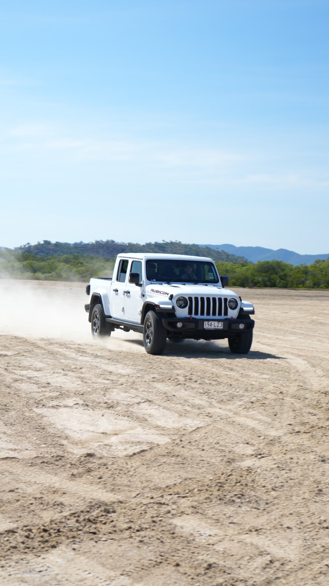 Jeep Gladiator Rubicon kicking up dust across the flats
