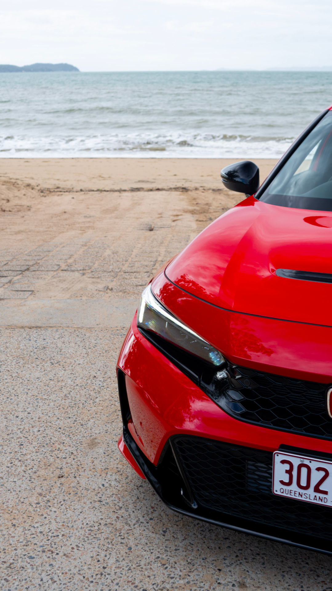 Civic Type R nose and bonnet with the beach behind